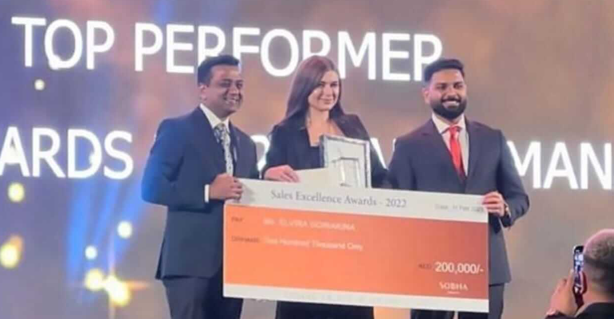 Elvira Goriakina receiving top performer award at Sobha